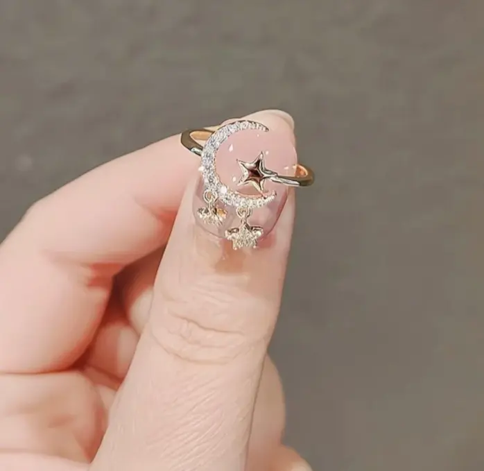 Adjustable moon and dangle star ring
