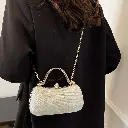 Glittering champegne cylinder evening clutch