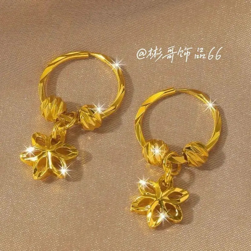 Dangle charm gold tone hoop earrings